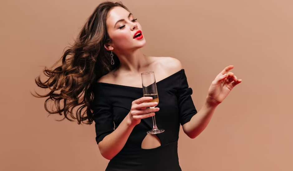 A woman wearing a black velvet dress.