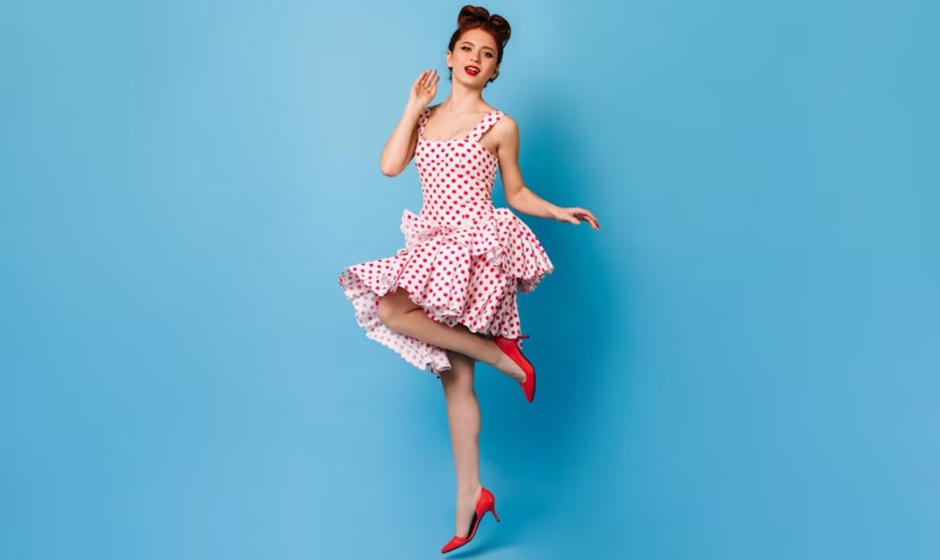 A woman wearing cute polkadot dress and red high heels