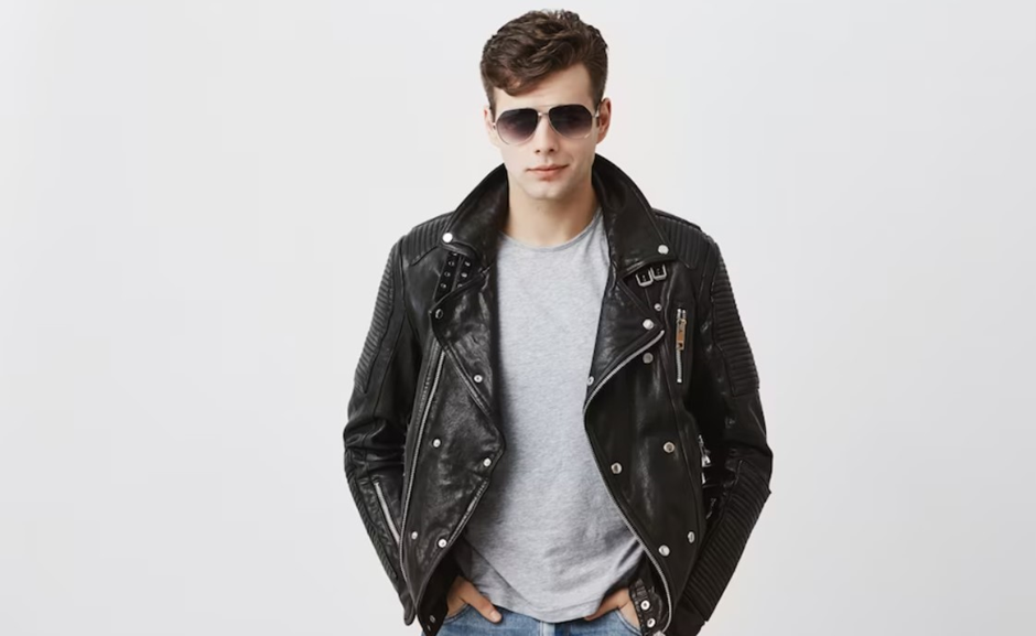 A man wearing leather jacket and jeans.