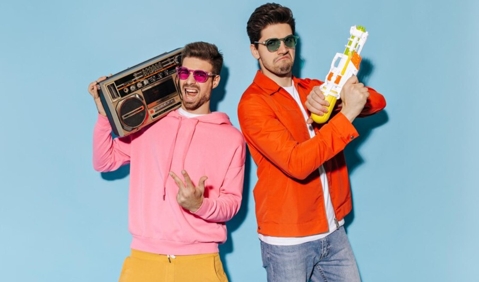 Two men wearing bright-coloured sweatshirt and jacket
